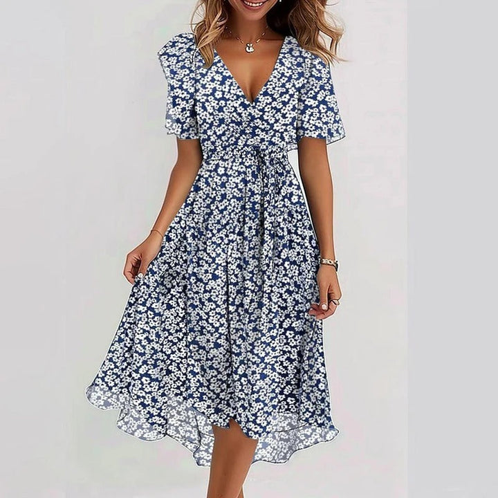Navy and white daisy print midi dress with V-neck and short puff sleeves
