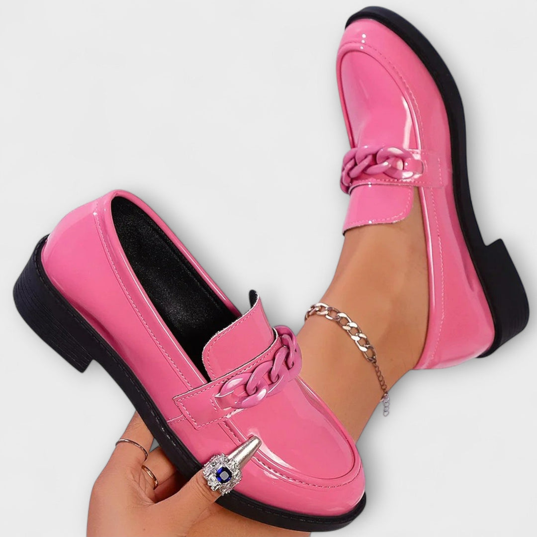 Merry round-toe casual loafers, glossy pink patent with braided chain detail and low heel
