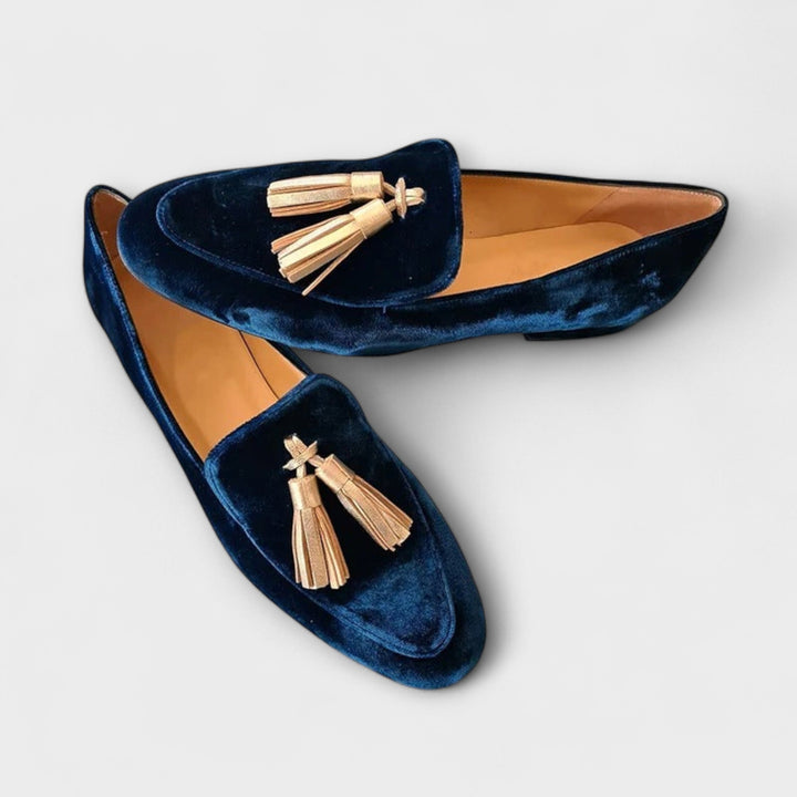 Dark blue velvet loafers with tasseled front and low slip-on profile