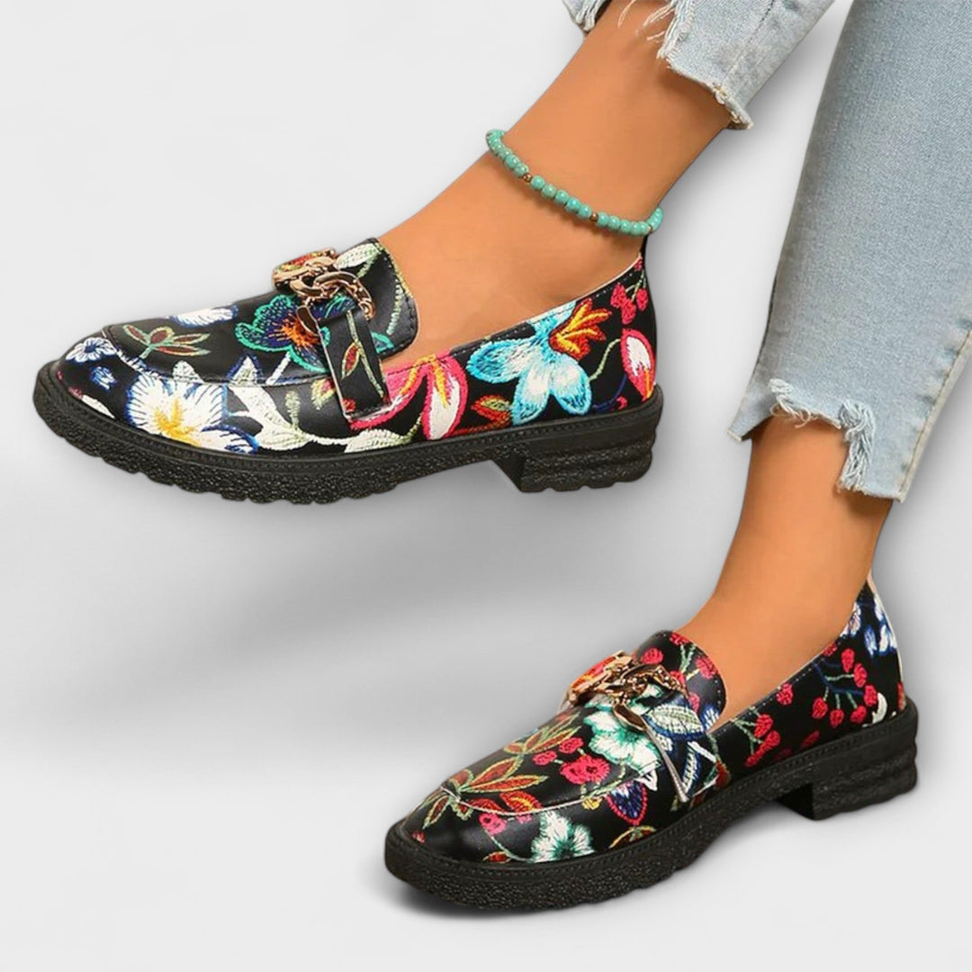 Multicolour floral loafer with gold chain buckle detail, black upper and low platform sole