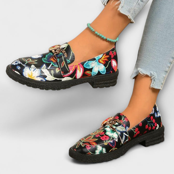 Multicolour floral loafer with gold chain buckle detail, black upper and low platform sole