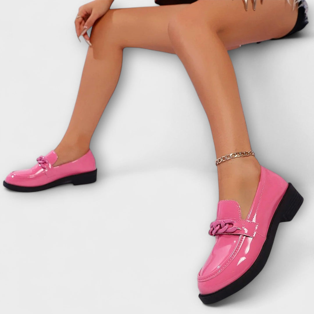 Merry round-toe casual loafers in glossy pink patent, braided chain detail with low heel