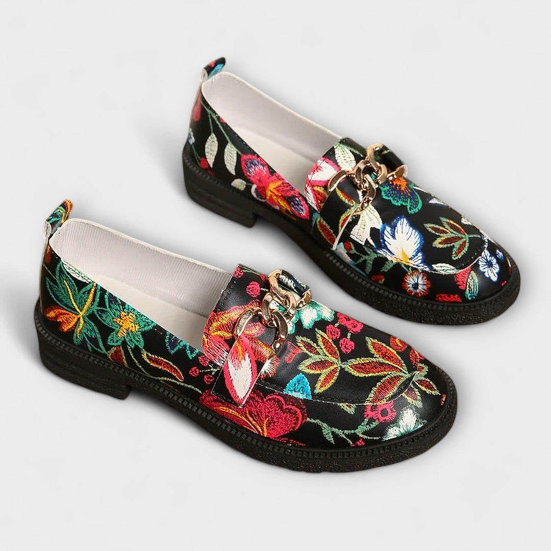 Multicolour embroidered loafers with gold chain buckle, black slip-on with flat rubber sole