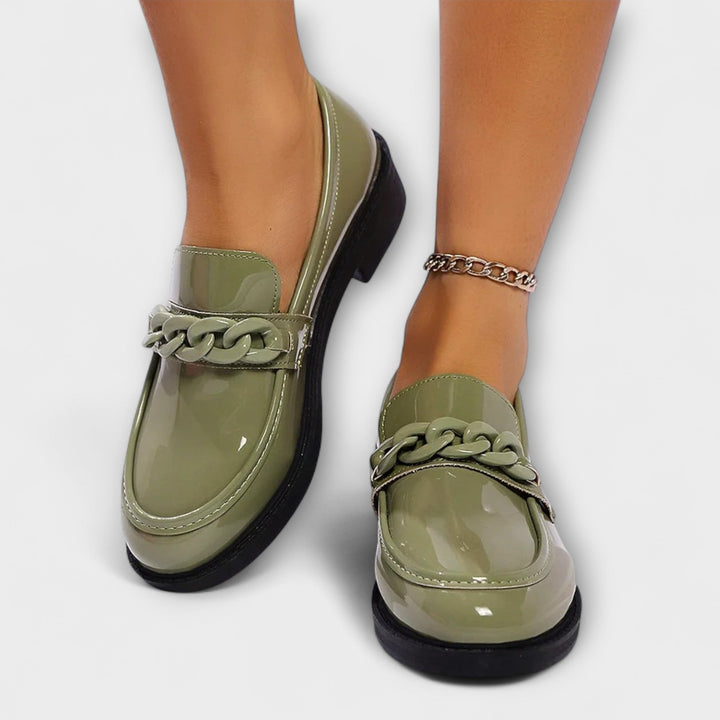 Merry round-toe casual loafers in glossy green patent, braided chain detail, low block heel
