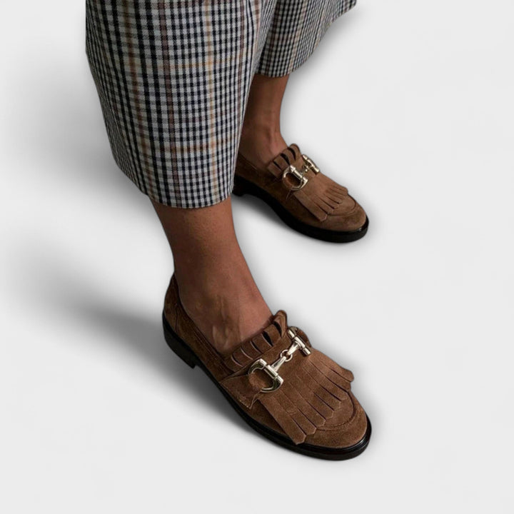 Brown suede moccasin shoes with round toe and metal buckle detail