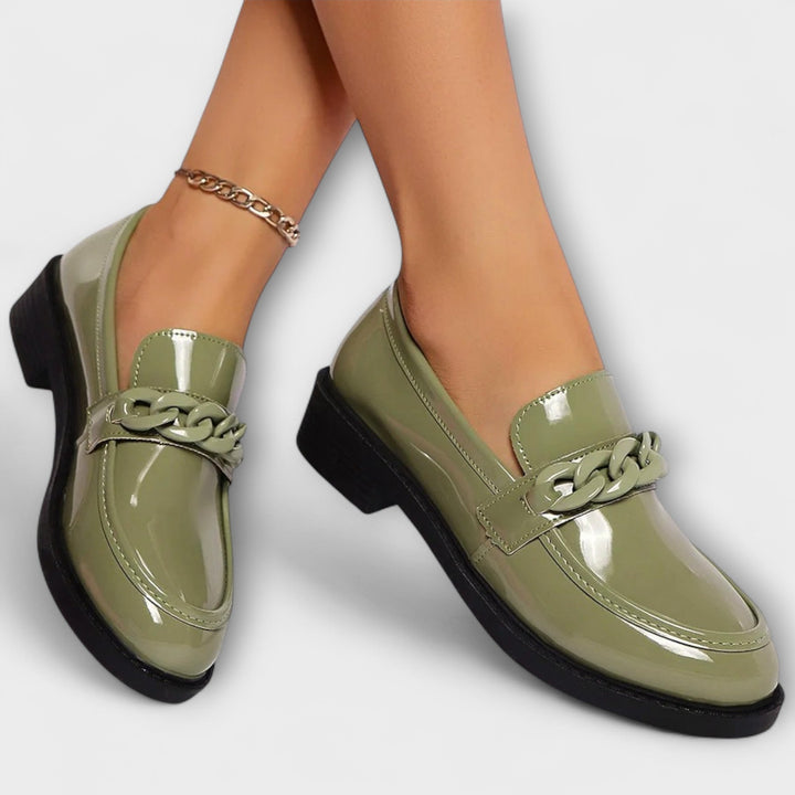 Merry round-toe casual loafers in glossy green patent, braided chain detail and low heel