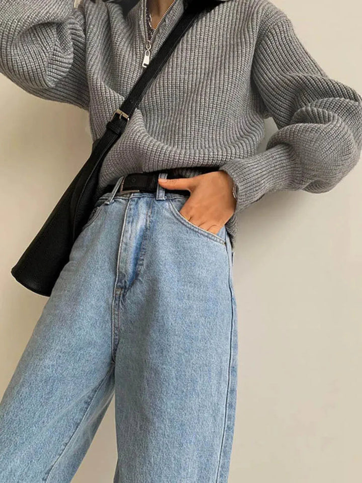 Gray knit half-zip sweater with long sleeves and ribbed stand collar, front zipper