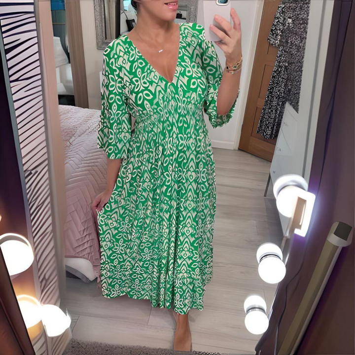 Green boho printed dress with V-neck and three-quarter flared sleeves, pleated midi hem