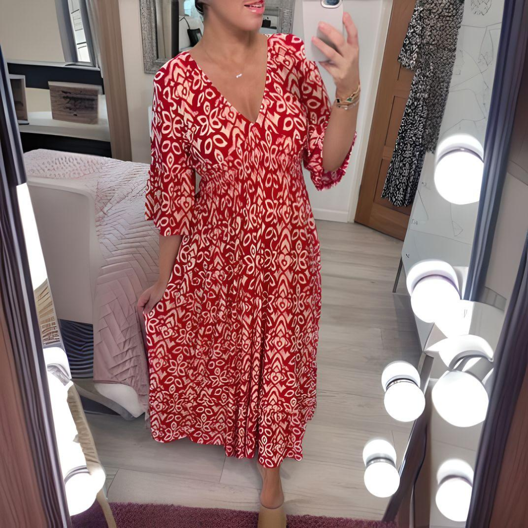 Red boho printed dress with V-neck and three-quarter sleeves, flowing tiered skirt