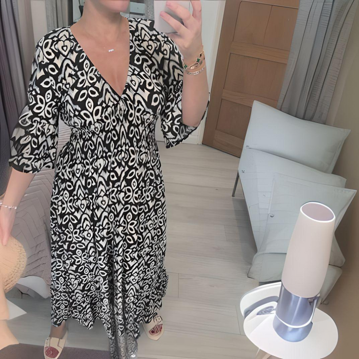 Black and white boho printed dress with V-neck and three-quarter sleeves, gathered skirt