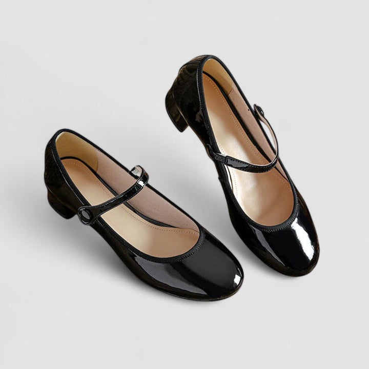 Black Mary Jane shoes with ankle strap and glossy rounded toe