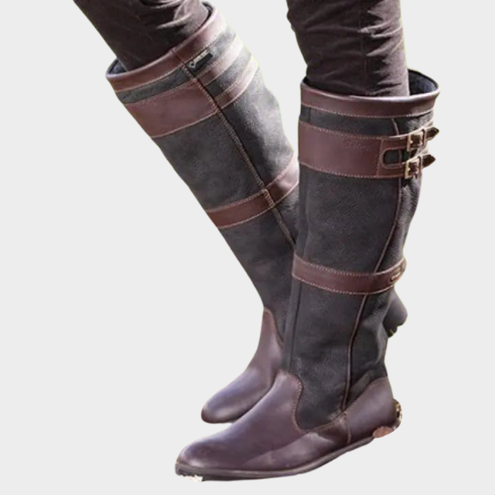 Dark brown high boots with cross-panel straps and side buckle detail