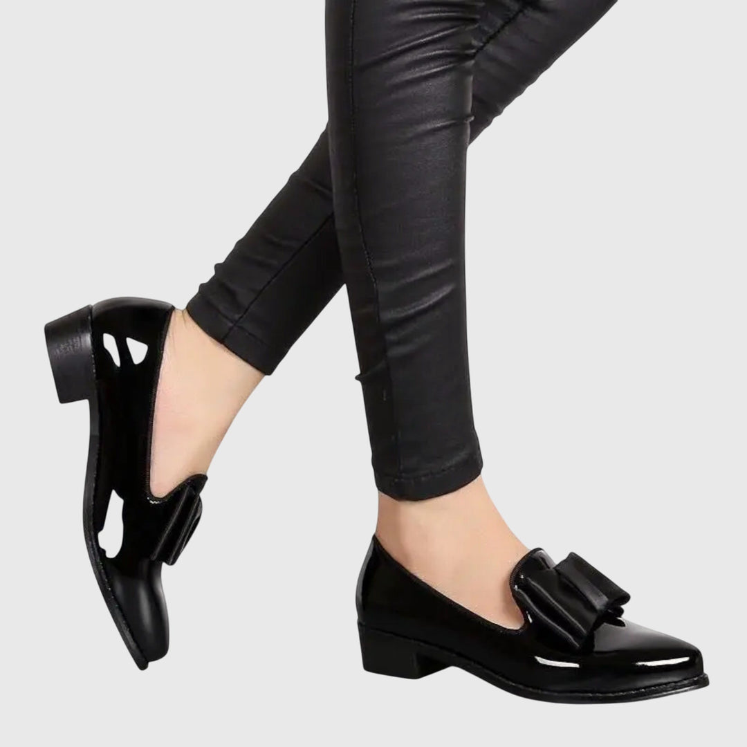 Black patent loafer with wide strap across the top and low block heel