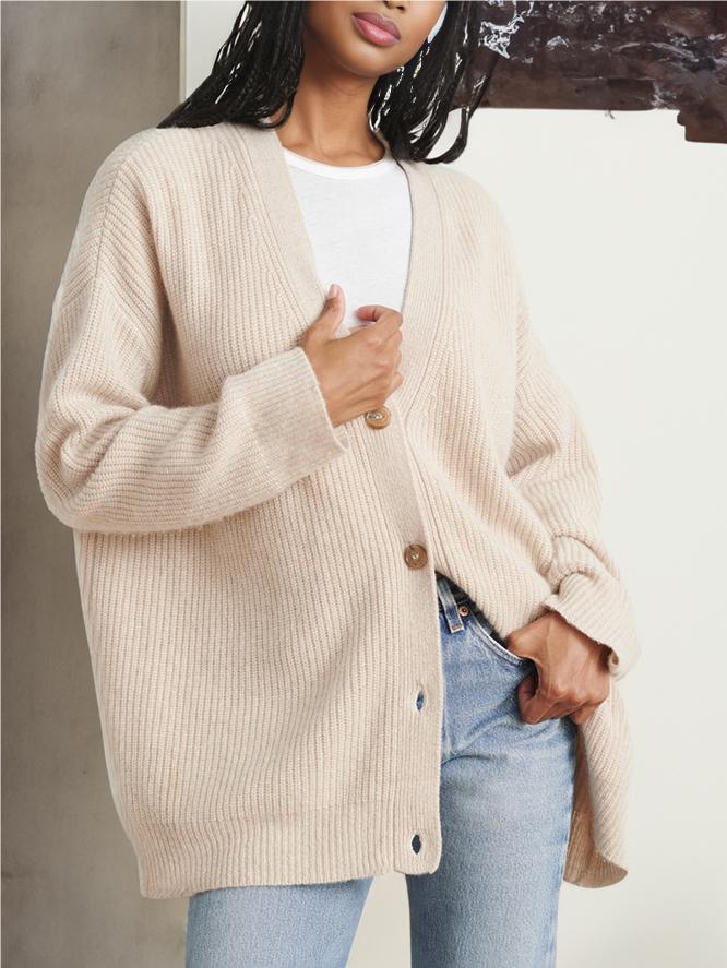 Oatmeal knit cardigan with V-neck, button front, relaxed cocoon fit, ribbed cuffs and hem.
