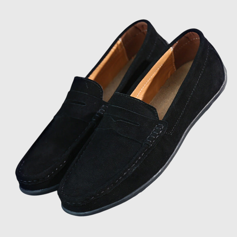 Black suede orthopaedic loafers with slip-on penny strap and low-profile tread sole