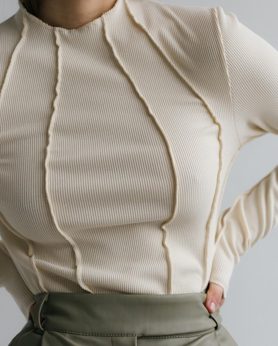 Women’s long sleeve ribbed top in light apricot with half-zip front