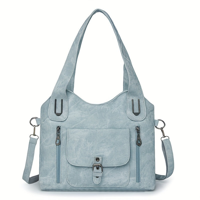 Light blue suede-look shoulder bag with top handles, front flap pocket, and side zippers