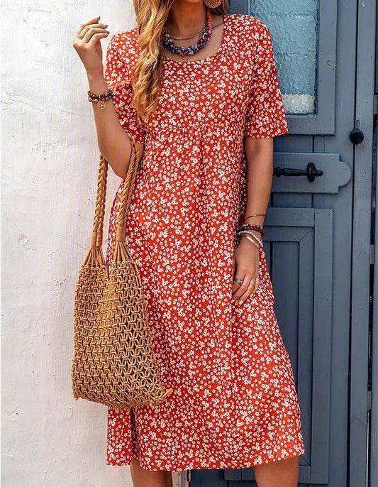 Floral summer dress in red with short sleeves and scoop neckline, midi length