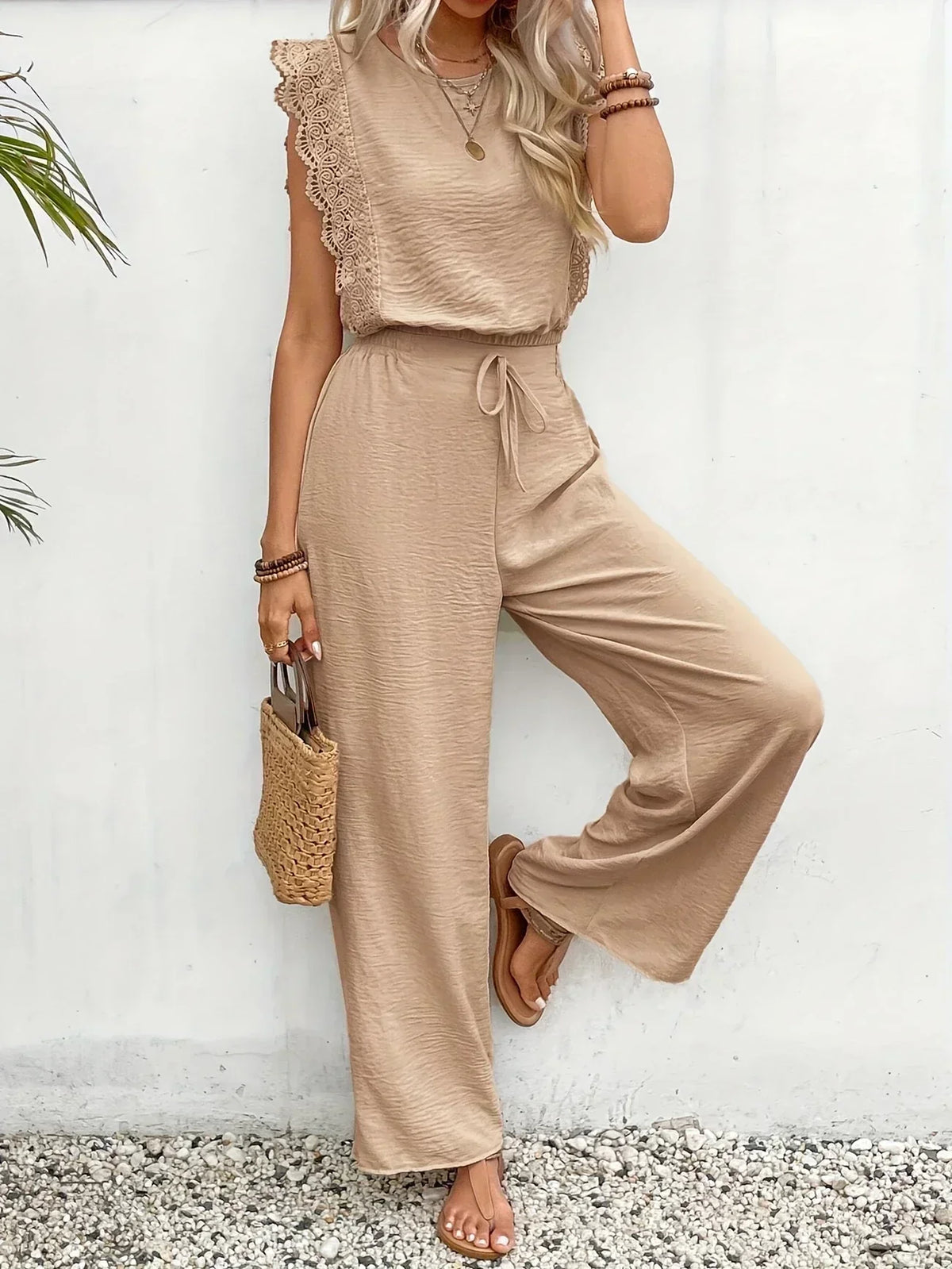 Women’s beige lace-trim sleeveless top and drawstring wide-leg trousers set, side pose