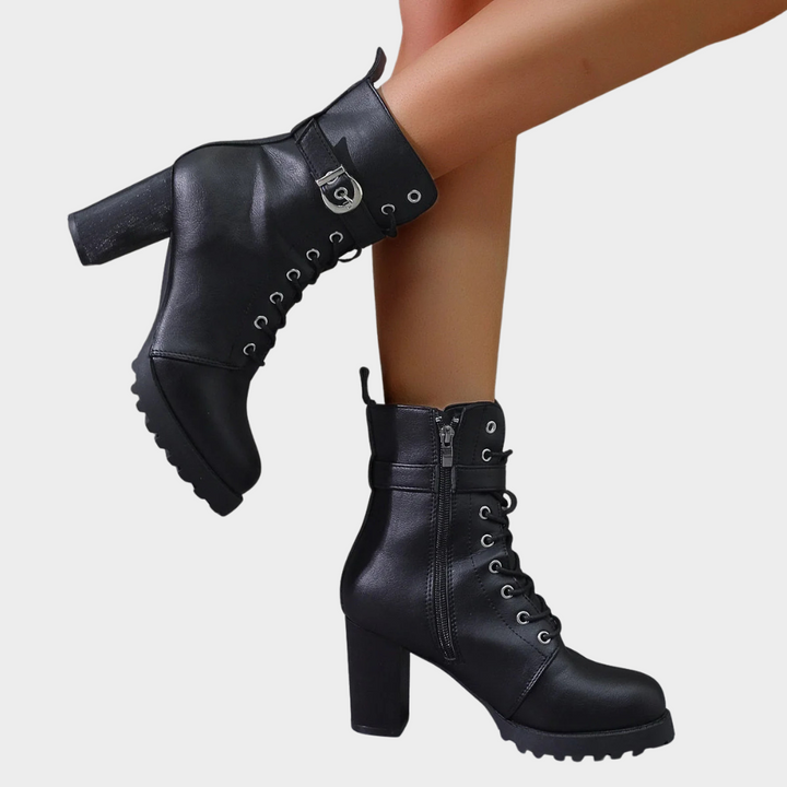 Black flared heel ankle boots with lace-up front, side zip, and chunky tread sole