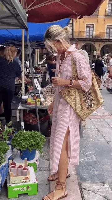Pink striped summer dress with button front, long sleeves and side slit