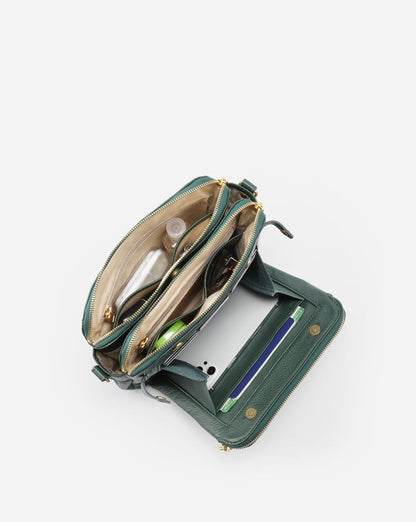 Jovie deep green crossbody bag, open view with interior pockets and card slots