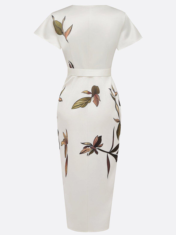White wrap midi dress back view with short sleeves and leaf print