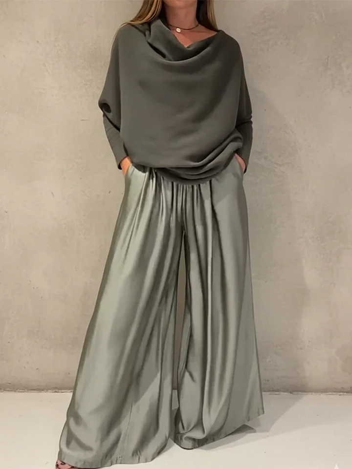 Off-shoulder dress set in sage green with draped cowl neck and pleated wide-leg skirt