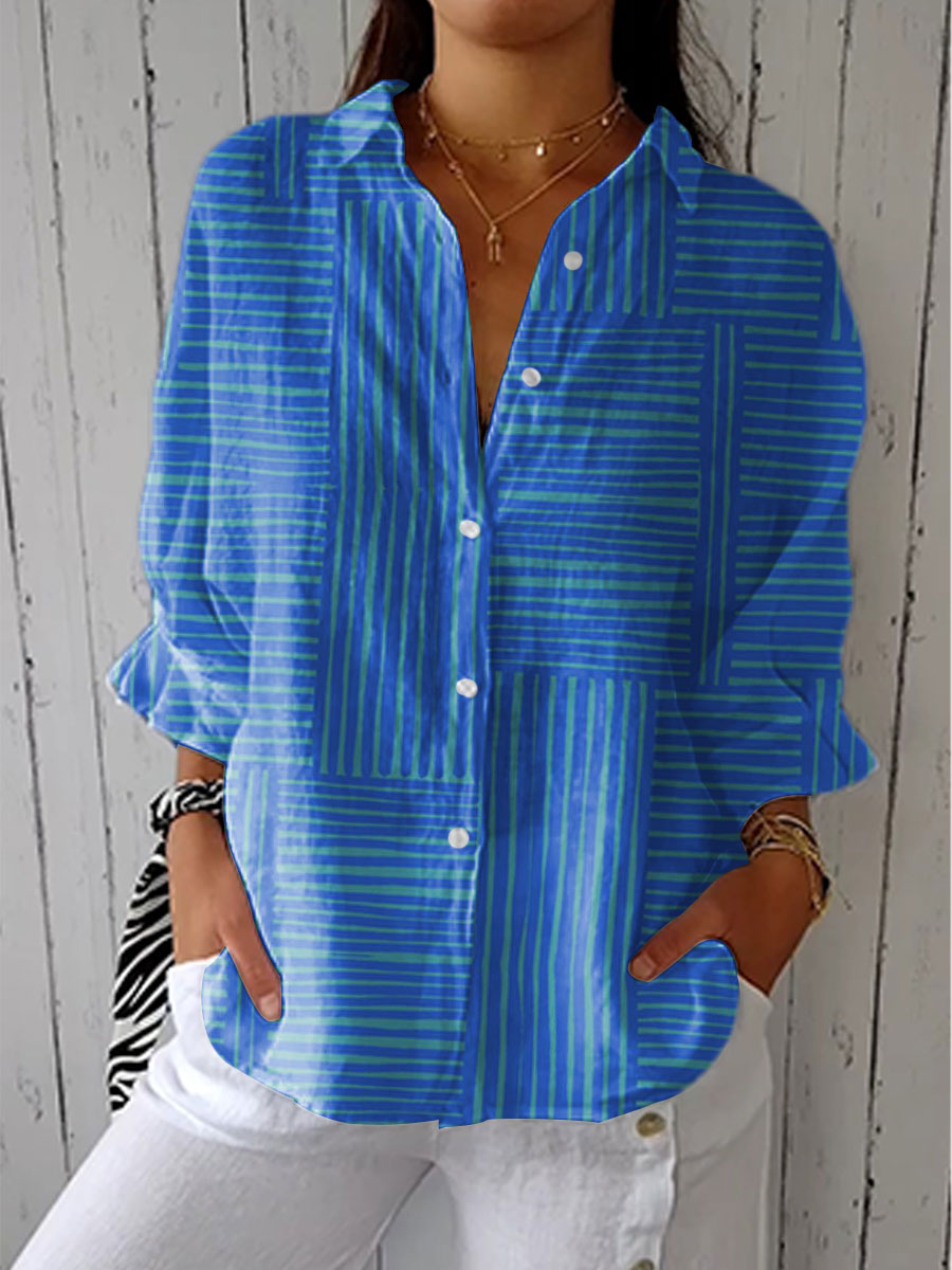 Blue striped button-front blouse with round neckline, long sleeves.