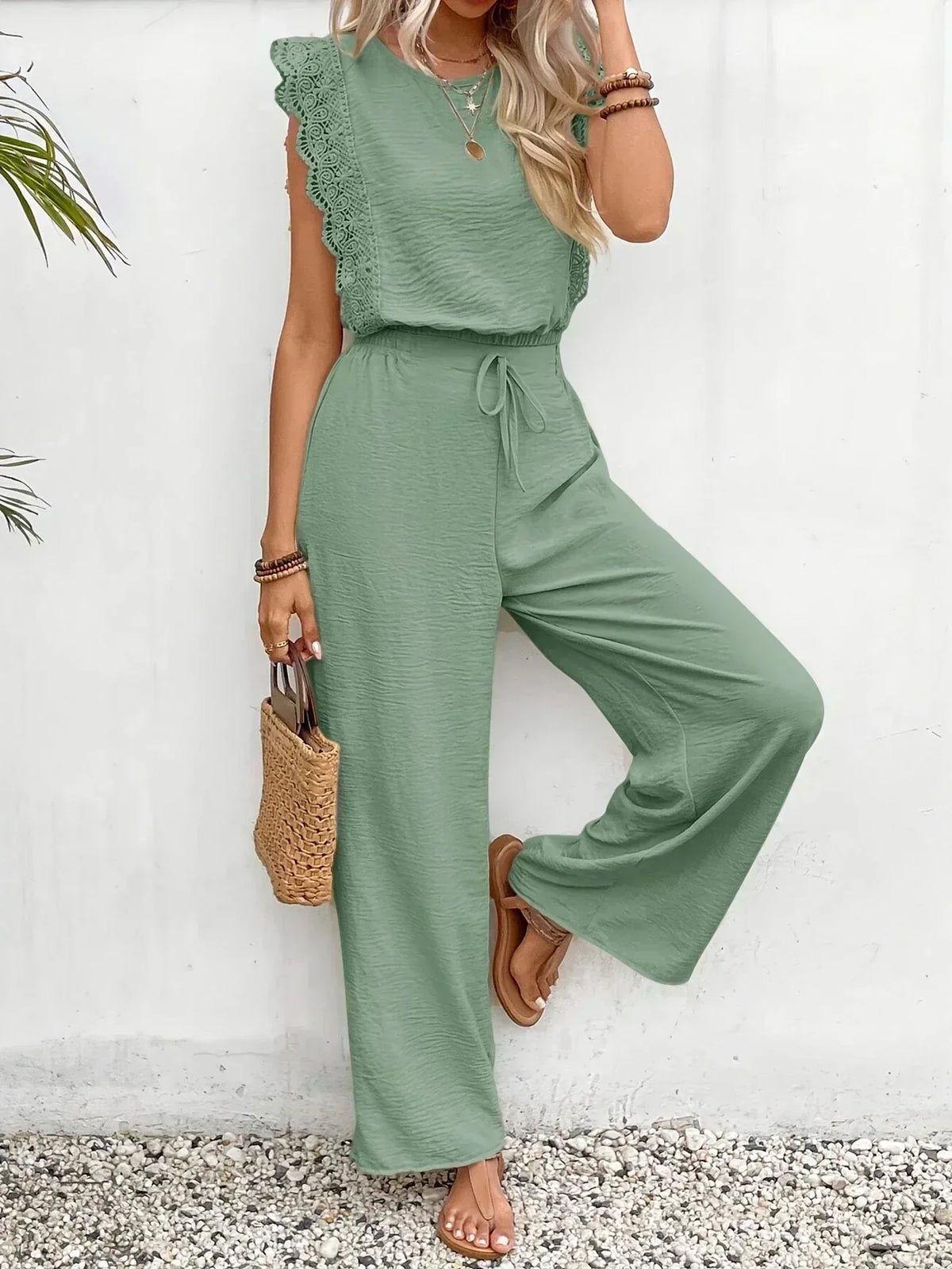 Women’s green lace-trim sleeveless top and drawstring wide-leg trousers set, side pose
