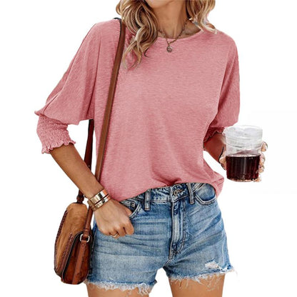 Pink lightweight short-sleeve blouse with gathered cuffs and relaxed fit