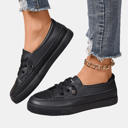 Black lace-up sneakers with thick platform sole and side stripe detailing