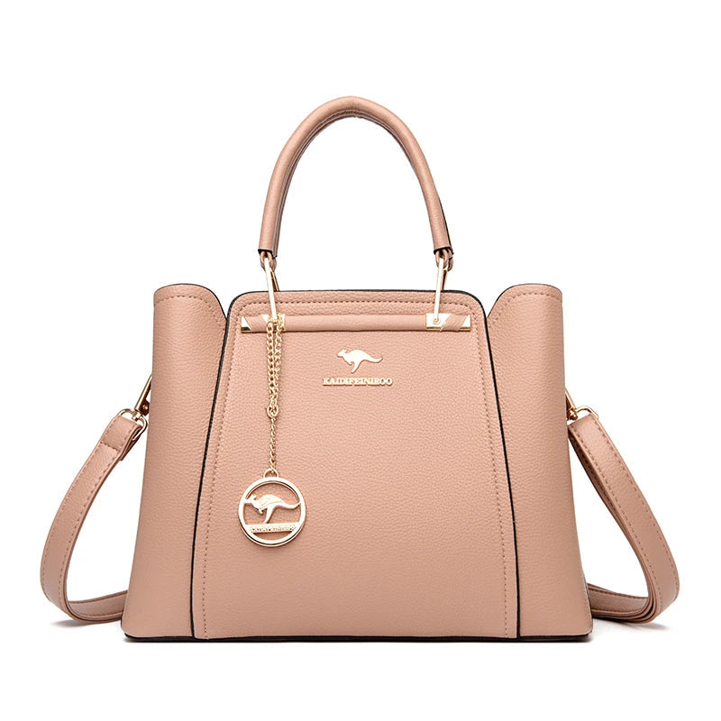 Women’s structured handbag with top handles, shoulder strap, and front panel, beige rose