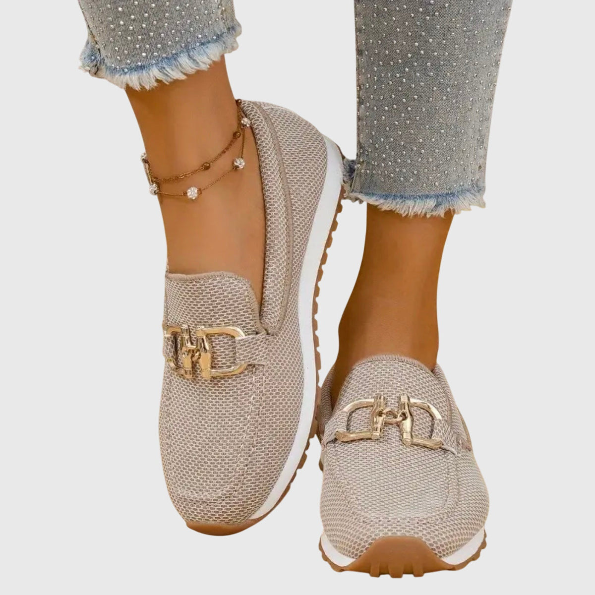 Beige textured loafer sneakers with gold-toned buckle accents