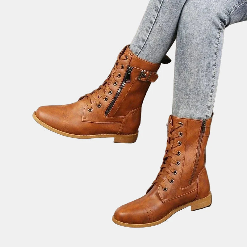 Brown round-toe lace-up fall boot with side zipper and buckle strap
