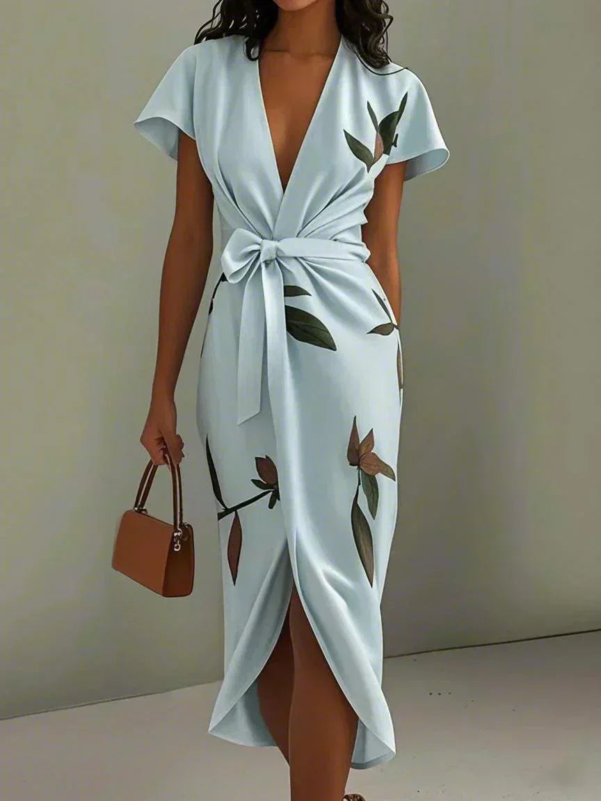 Light blue wrap midi dress with short sleeves, V-neck, leaf print, and bow waist tie