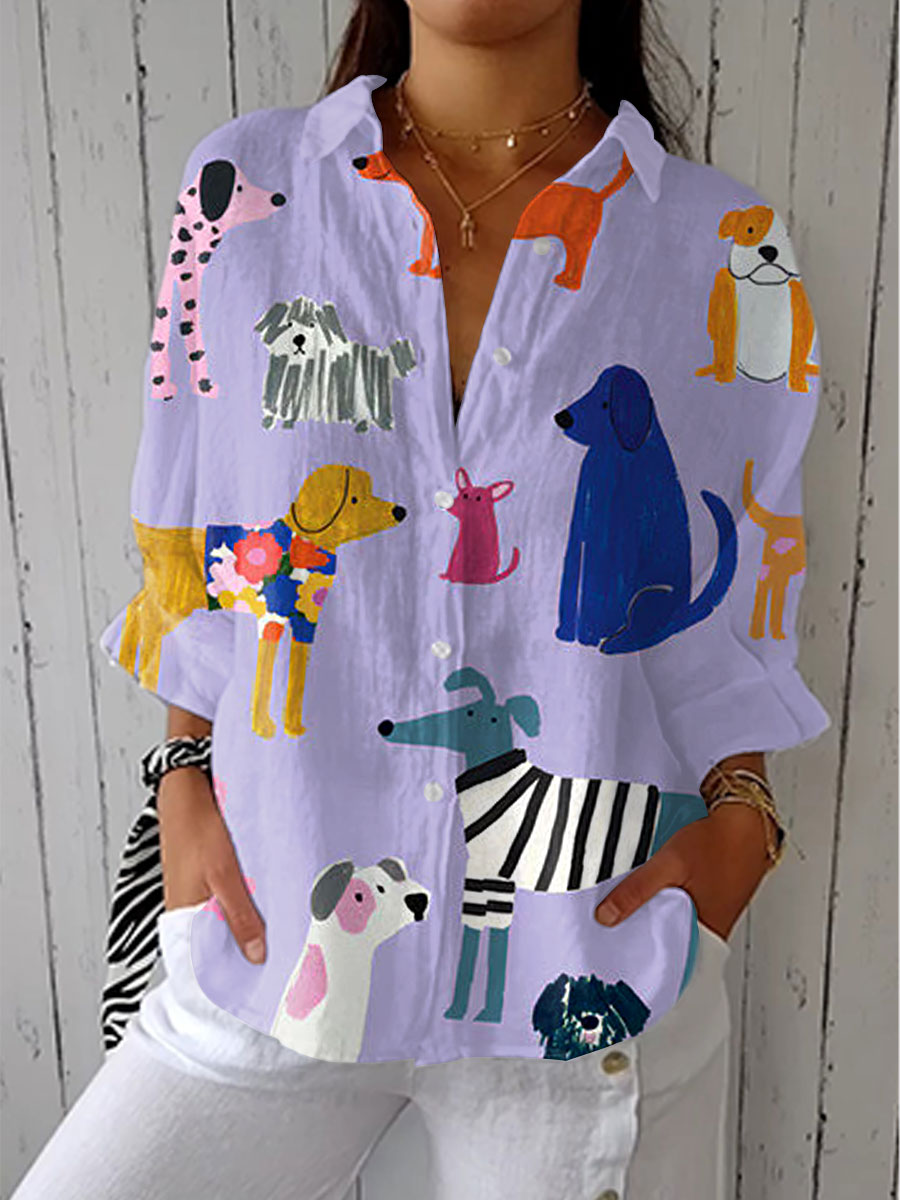 Light purple dog-print blouse with colorful pups, button-up front and collar, long sleeves