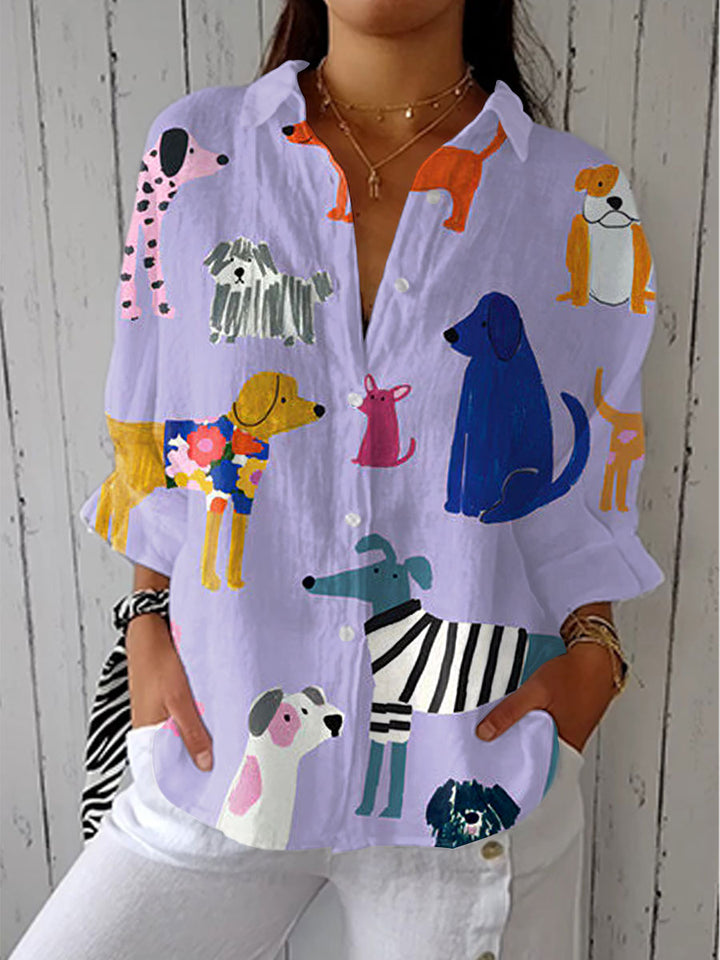 Light purple dog-print blouse with colorful pups, button-up front and collar, long sleeves