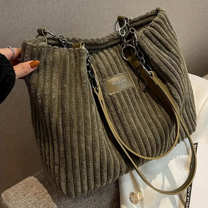 Large capacity corduroy tote bag in olive green with top zipper and crossbody strap