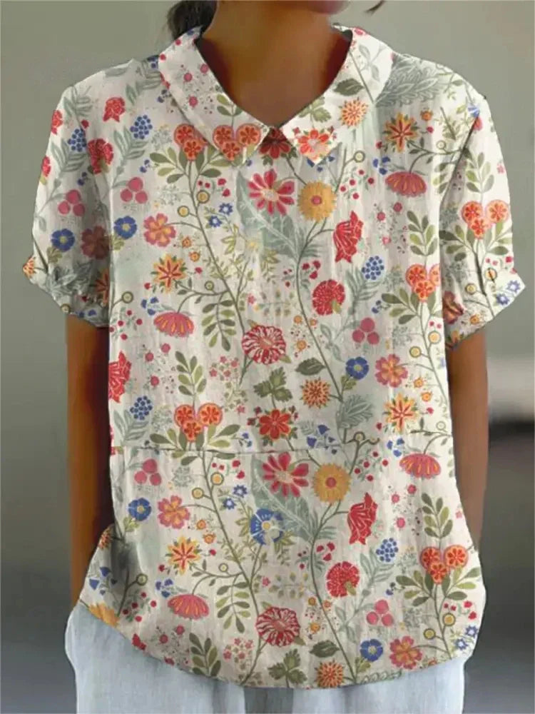 Women’s vintage floral print shirt, white with multicolor flowers, V-neck and short sleeves