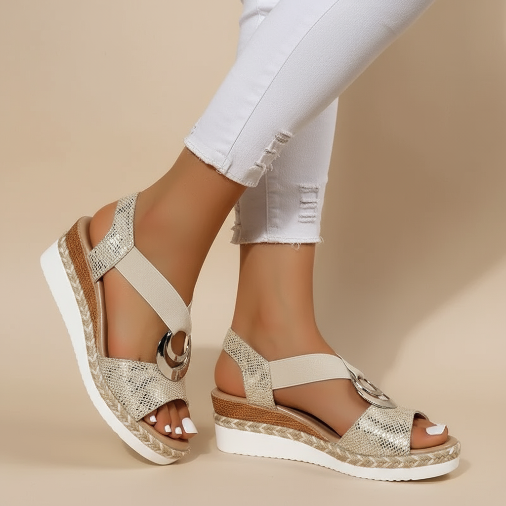 Gold platform espadrille sandals with ankle strap and metallic ring detail