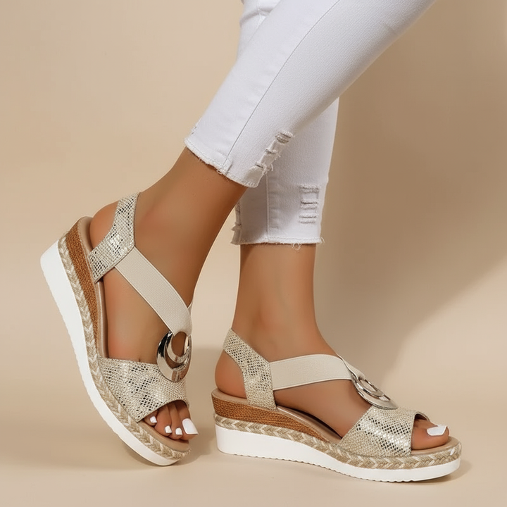 Gold platform espadrille sandals with ankle strap and metallic ring detail