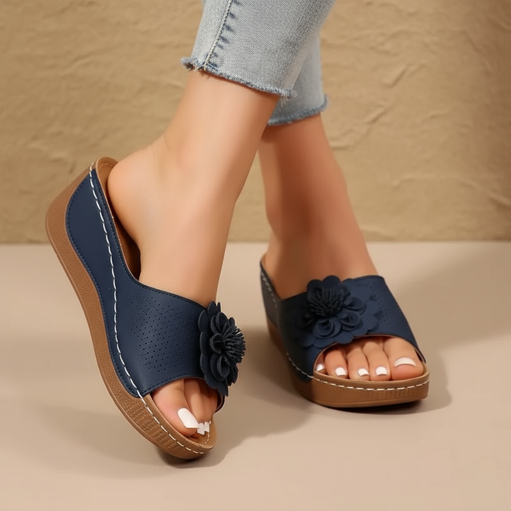 Ergonomic sandals in dark blue with flower appliques and perforated upper