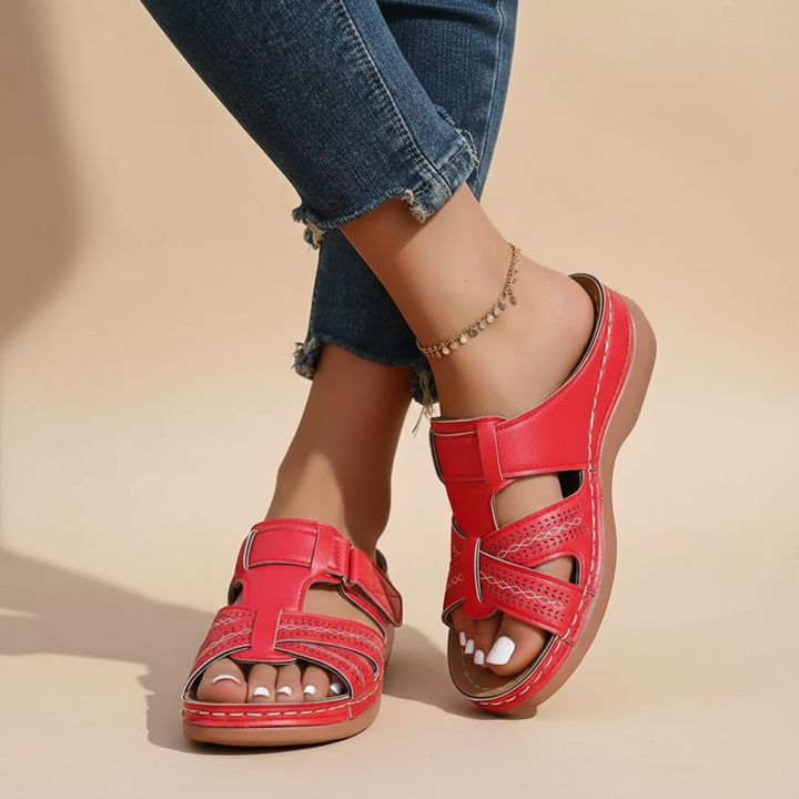 Vivian red ergonomic sandals with ankle strap and perforated slide panels, cushioned sole