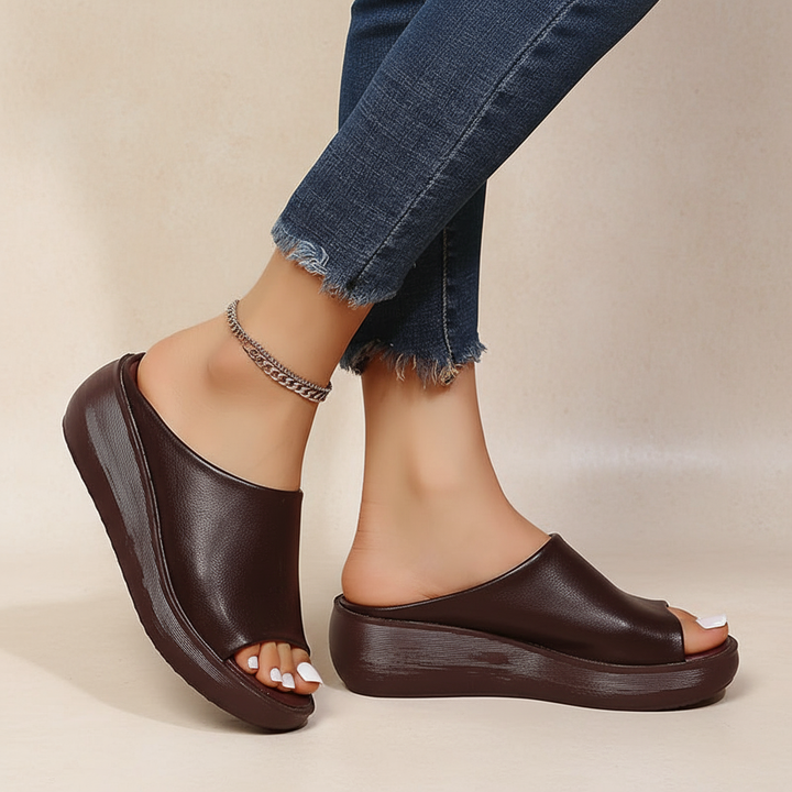 Brown orthopedic slide sandals with wide open toe and thick platform sole