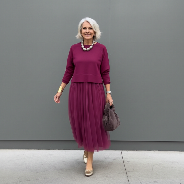 Fuchsia knit layered dress set with three-quarter sleeves and pleated midi skirt