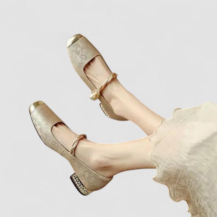 Gold Mary Jane orthopedic shoes with T-strap, round toe, and jeweled heel trim