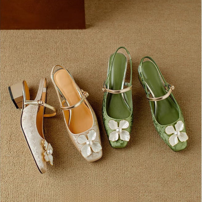 Set of beige and green pumps with white flower details and ankle straps