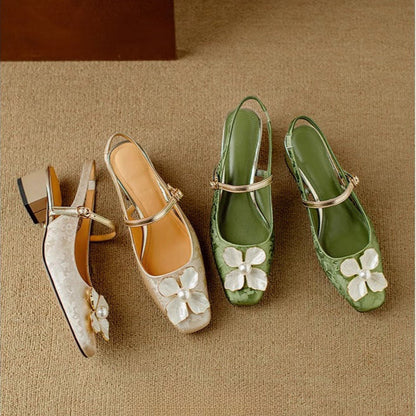Set of beige and green pumps with white flower details and ankle straps