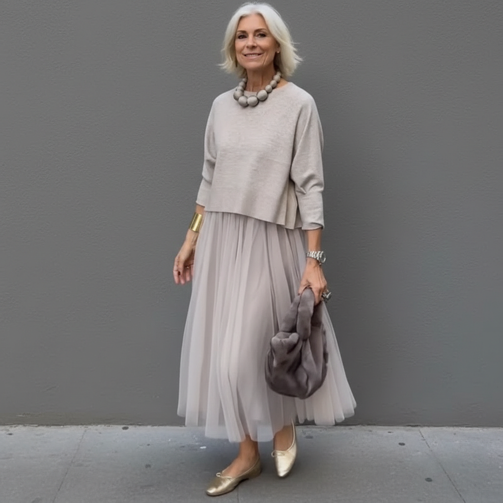 Light tan knit dress set with 3/4 sleeve top and flowing pleated tulle midi skirt